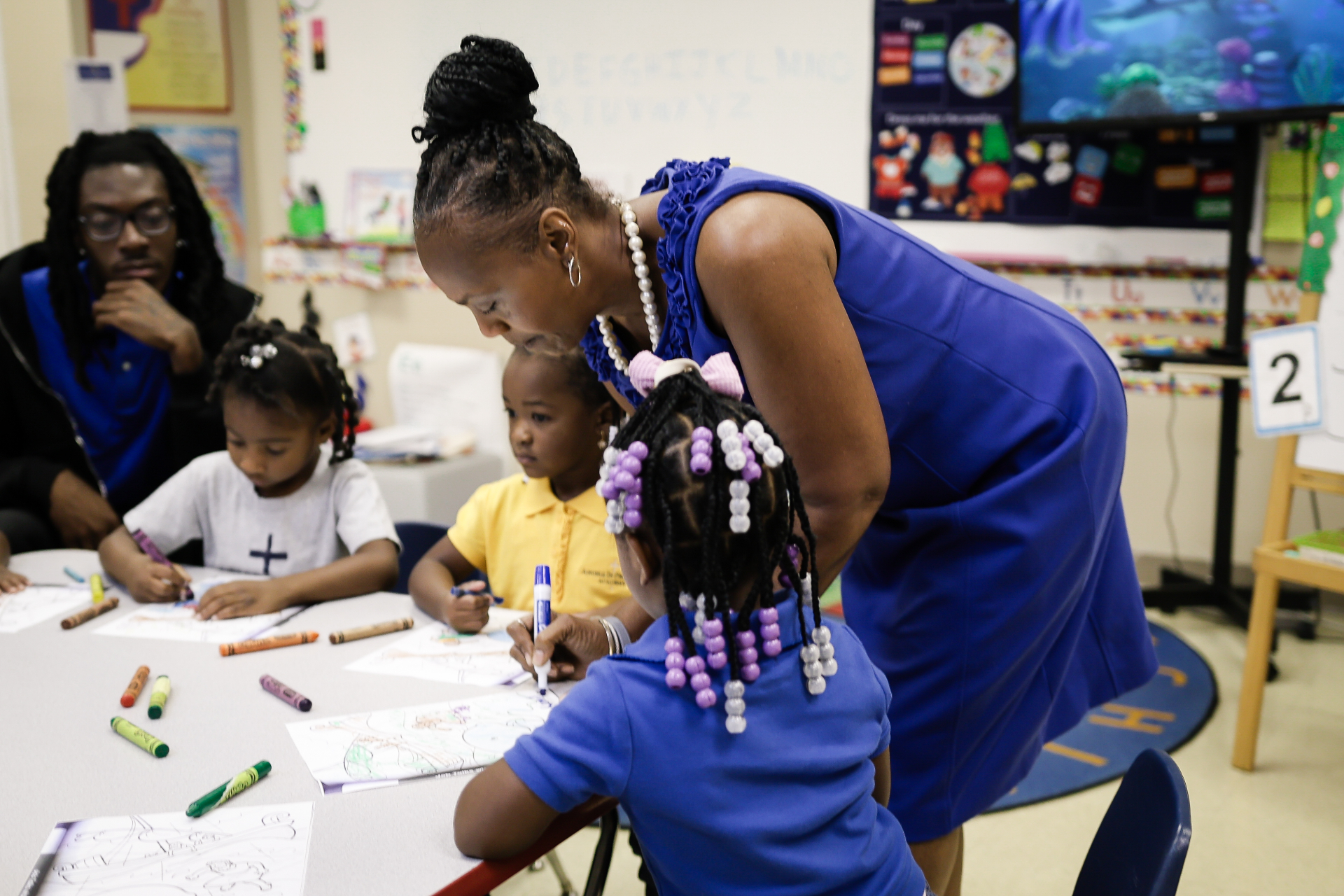 Angels In Progress Academy founders with students